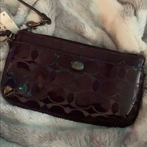 Coach plum Wristlet